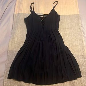 Strappy black dress by Volcom. Size S. NWOT!